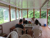 trekkers-taking-rest-at-tea-house-and-drinking-tea-on-the-ghorepani-poon-hill,-ghandruk-trek-,-best-short-trek-from-pokhara