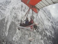 Thrilling ultralight flight over the stunning Annapurna mountain range above the clouds